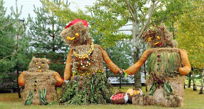 Autumn harvest decoration scarecrow family mother father and child