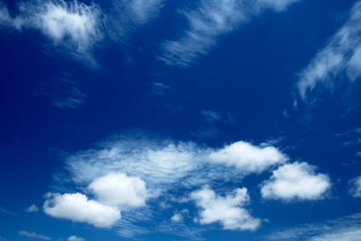 blue sky background with tiny clouds