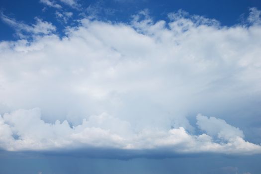 Blue sky background with a tiny clouds