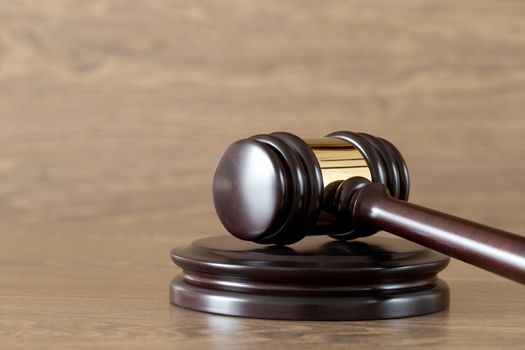 judge gavel on the brown wooden background