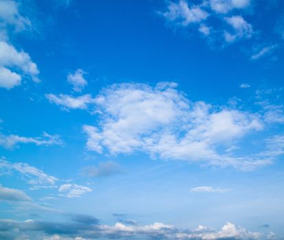 Blue sky background with a tiny clouds