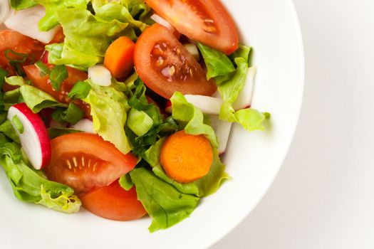 vegetable salad close up in a white bowl