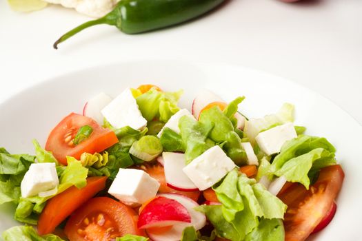 vegetable salad close up in a white bowl