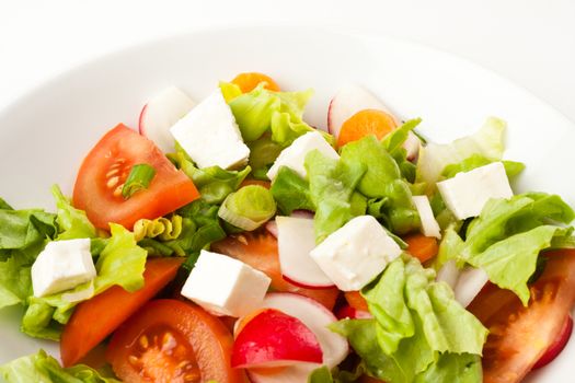 vegetable salad close up in a white bowl