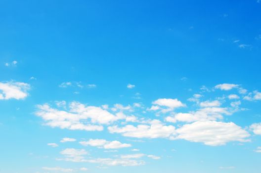 Blue sky background with a tiny clouds