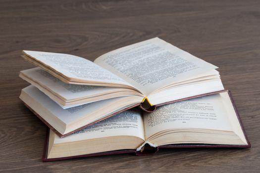 Open book on wood background