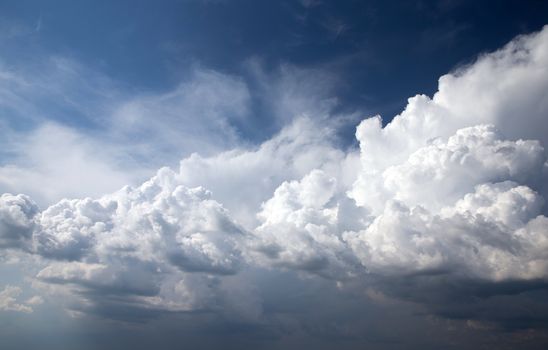 Blue sky background with a tiny clouds