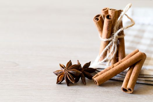 anise and cinnamon, on wooden table

