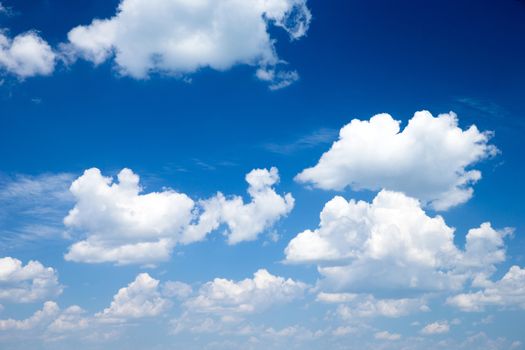 blue sky background with tiny clouds