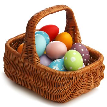 Basket with eater eggs isolated on white background