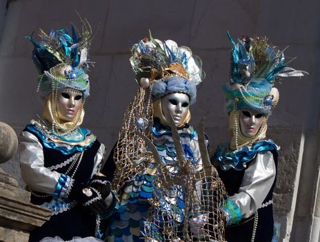 Three blue people at the 2014 Annecy venetian carnival, France