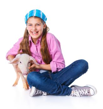 Little farmer. Cute girl with pig. Isolated on white background.