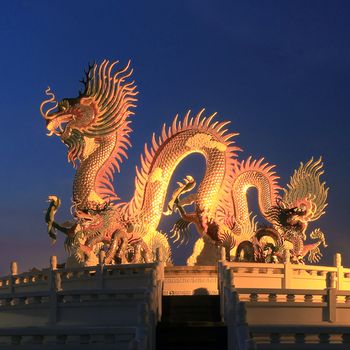 Chinese dragon statue at the twilight time