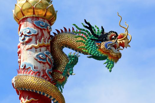 golden Chinese dragon on beautiful sky background