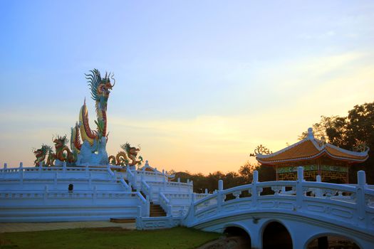 golden Chinese dragon statue on beautiful sky background