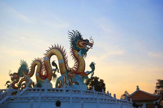 Chinese dragon statue at the twilight time
