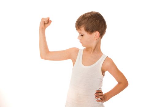 Boy showing his muscle on white background