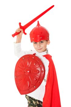 Young Boy Dressed Like a knight holding a sword and shield isolated on white