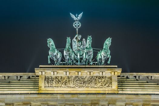 BRANDENBURG GATE, Berlin, Germany at night. Road side view