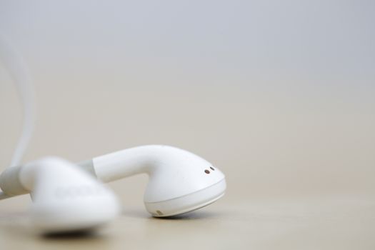 Modern and small earphones on a desk