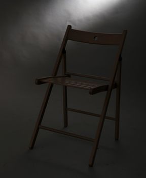 A wood foldable chair isolated on studio