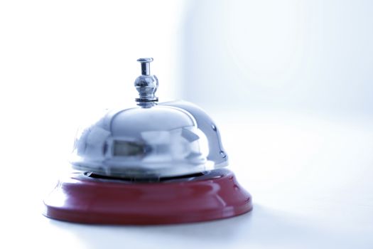 Close up photo of a bell in a hotel