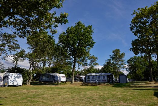 Campers in a beautiful camping site in the middle of nature