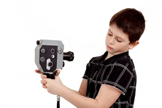 young boy with old vintage analog 8mm camera filming yourself