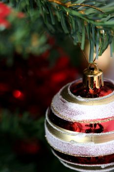 Close up of Christmas ornaments on tree.