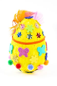 A yellow Easter egg on a white background