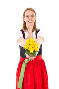 Beautiful woman in dirndl giving bunch of roses