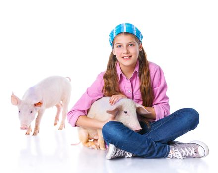 Little farmer. Cute girl with pig. Isolated on white background.