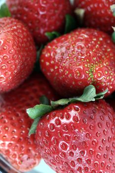 Macro picture of fresh and tasty strawberries .