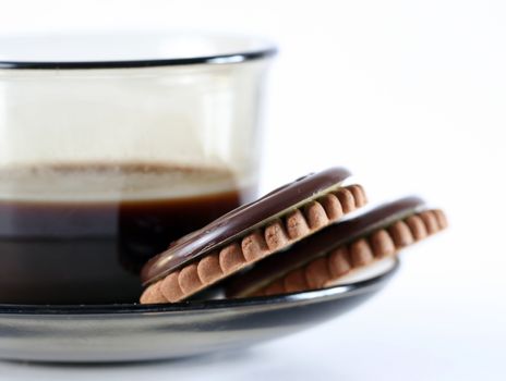 Cup with coffee and cookies.