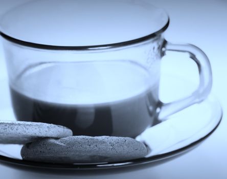 Cup with coffee and cookies.