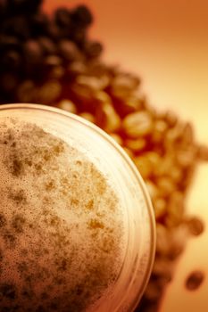 Latte Macchiato in glass costing on coffee grain