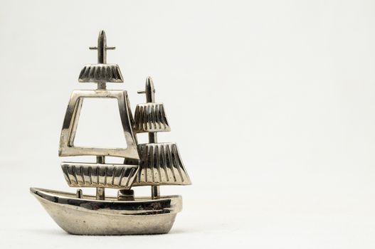 Metal Sailing Boat Figurine on a white background