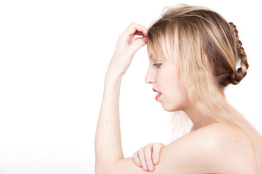 Portrait from young blond woman on a white background with much skin visible