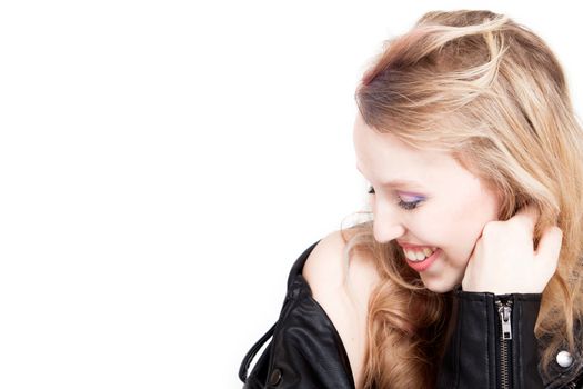 Young tough blond teenage girl with leather jacket on a white background