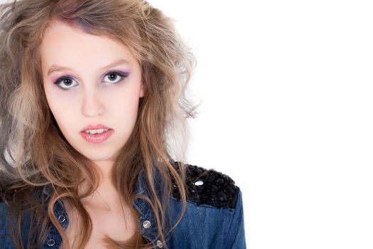 Young tough blond teenage girl with jeans blouse on a white background