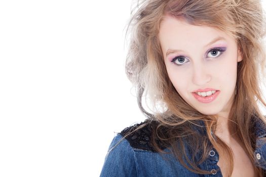 Young tough blond teenage girl with jeans blouse on a white background