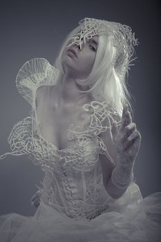 Mystic queen. Beautiful model with long white hair and vintage corset
