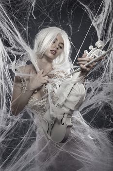 Music. Beautiful model with long white hair and vintage corset