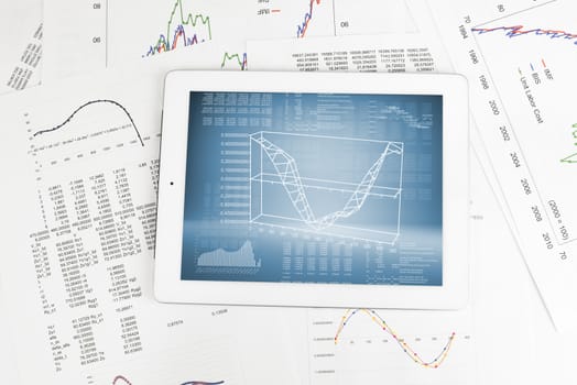 Tablet pc and paper with graphs. Business concept