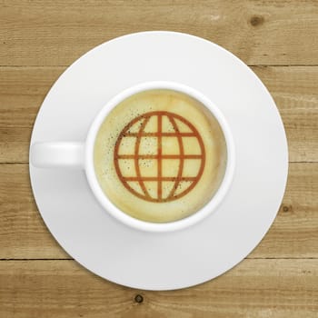 Cup of coffee standing on a wooden surface. Picture of the globe in the coffee crema. top view