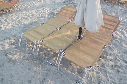 Beach with sunbeds and umbrellas.