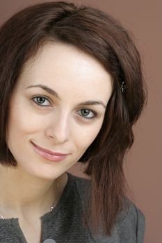 Portrait of a happy beautiful woman with green eyes.