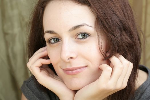 Beautiful happy woman with green eyes.