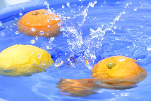 Oranges and lemons in water