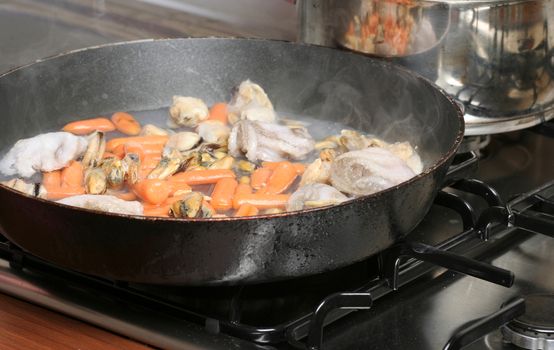 Vegetables fryed in a pan.